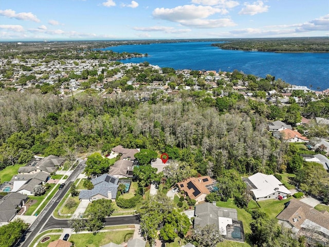 drone / aerial view with a residential view and a water view