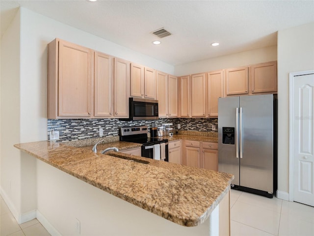 405 Laguna Mill Dr, Ruskin, FL 33570 - kitchen with stainless steel appliances, light brown cabinetry, a peninsula, light stone countertops, and recessed lighting