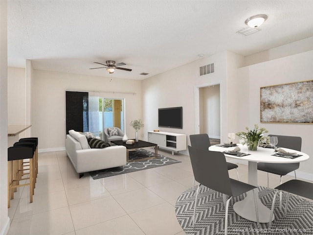 405 Laguna Mill Dr, Ruskin, FL 33570 - living area featuring a ceiling fan, light tile patterned floors, and a textured ceiling