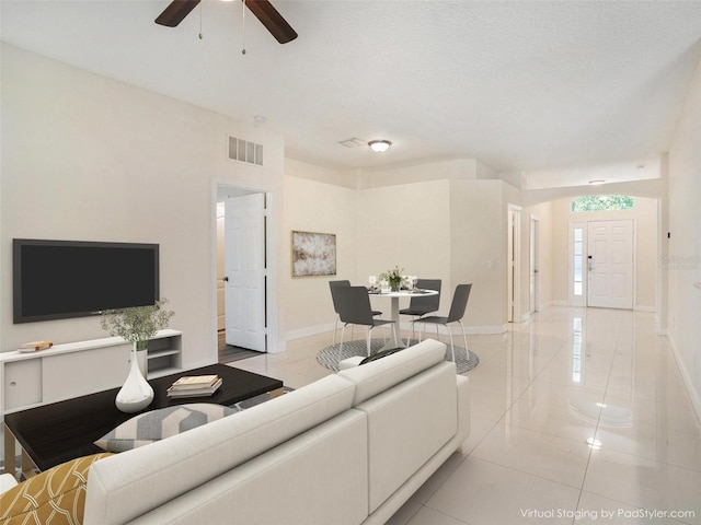 405 Laguna Mill Dr, Ruskin, FL 33570 - living room featuring light tile patterned floors and ceiling fan