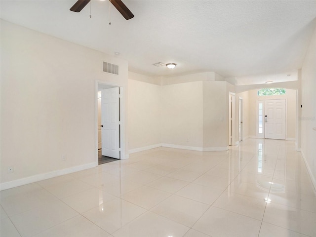 405 Laguna Mill Dr, Ruskin, FL 33570 - empty room featuring light tile patterned floors and a ceiling fan