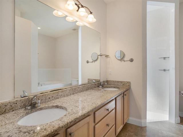 405 Laguna Mill Dr, Ruskin, FL 33570 - bathroom with a garden tub, double vanity, tile patterned flooring, and tiled shower