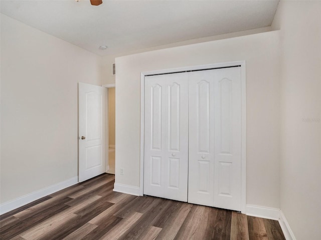 405 Laguna Mill Dr, Ruskin, FL 33570 - unfurnished bedroom featuring dark wood-style flooring and a closet