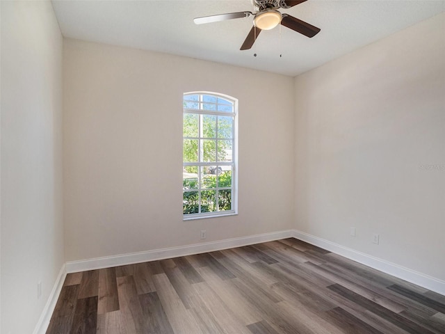 405 Laguna Mill Dr, Ruskin, FL 33570 - empty room with dark wood-style flooring and a ceiling fan