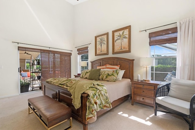 17503 Edinburgh Dr, Tampa, FL 33647 - bedroom featuring access to exterior, a towering ceiling, and light carpet