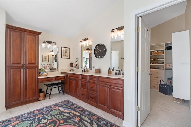 17503 Edinburgh Dr, Tampa, FL 33647 - full bath featuring vaulted ceiling, double vanity, tile patterned floors, and a sink