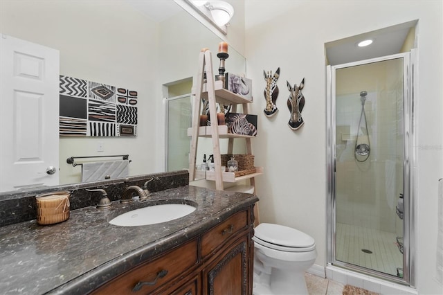 17503 Edinburgh Dr, Tampa, FL 33647 - bathroom with tile patterned floors, a shower stall, toilet, and vanity