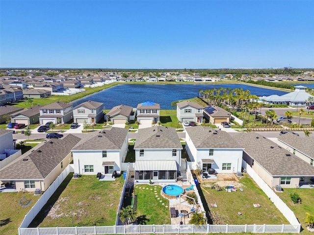 bird's eye view featuring a residential view and a water view