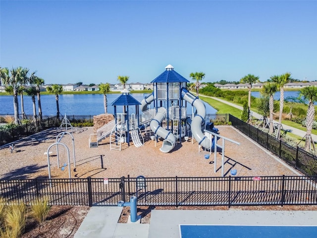 communal playground with fence and a water view