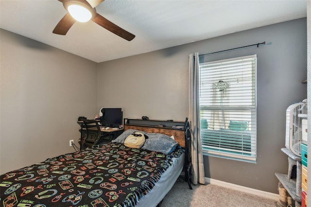 bedroom featuring baseboards, carpet floors, and ceiling fan
