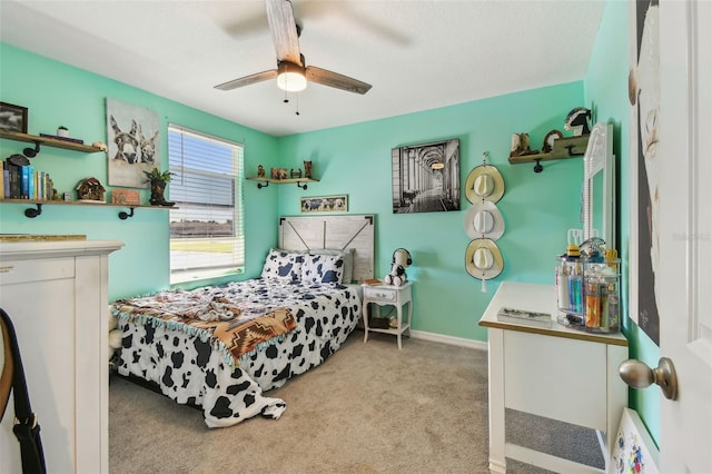carpeted bedroom with baseboards and a ceiling fan