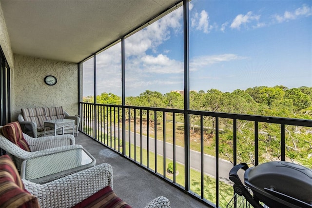 sunroom with a view of trees