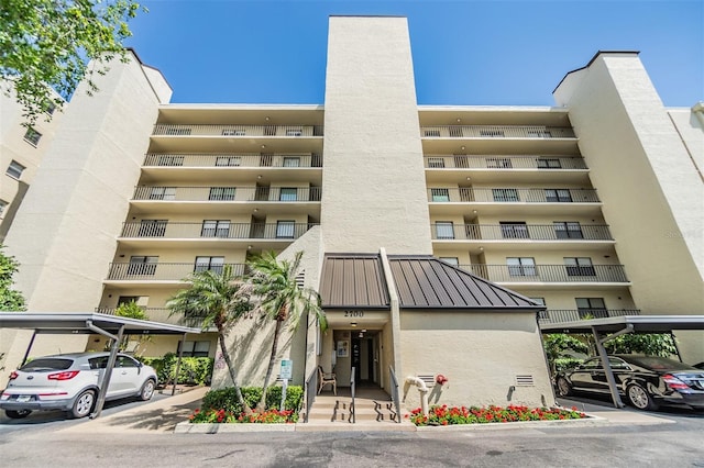 view of property with covered parking