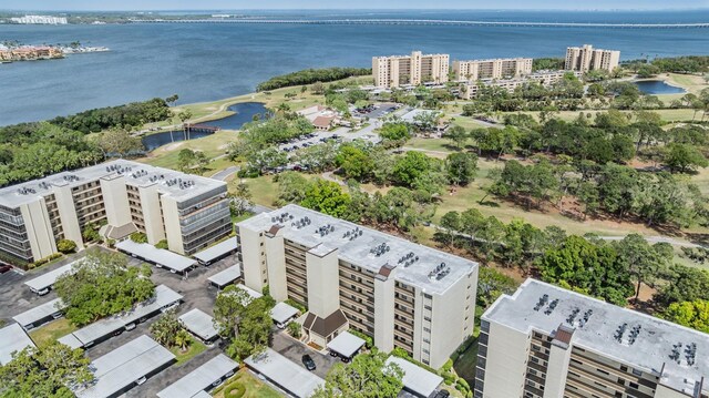 birds eye view of property featuring a city view and a water view