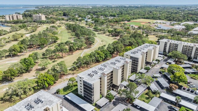 birds eye view of property featuring a water view and view of golf course