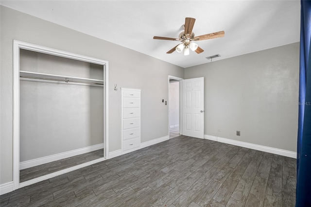 3310 W Swann Ave, Tampa, FL 33609 - unfurnished bedroom featuring visible vents, baseboards, dark wood finished floors, a closet, and a ceiling fan