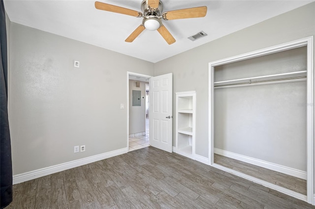 3310 W Swann Ave, Tampa, FL 33609 - unfurnished bedroom featuring wood finished floors, visible vents, a closet, and baseboards
