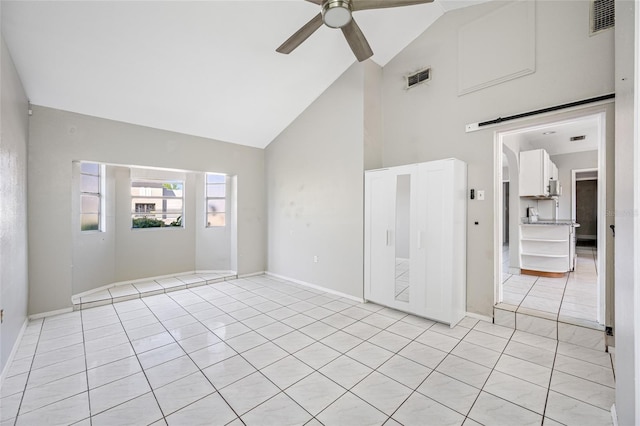 3310 W Swann Ave, Tampa, FL 33609 - unfurnished room featuring visible vents, a barn door, high vaulted ceiling, and a ceiling fan
