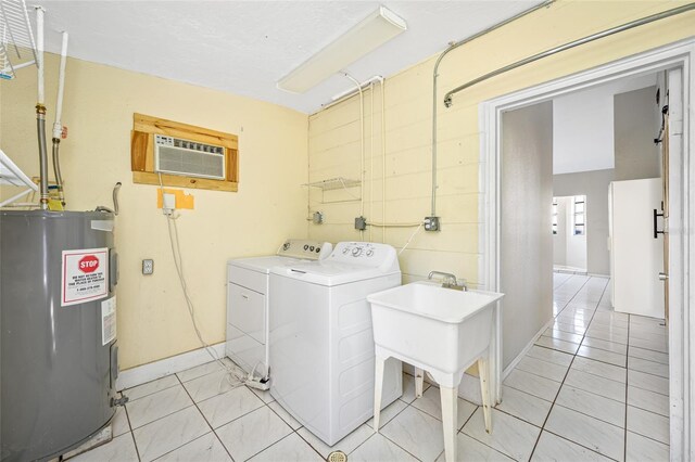 3310 W Swann Ave, Tampa, FL 33609 - laundry area featuring a wall mounted AC, laundry area, light tile patterned flooring, electric water heater, and washing machine and dryer