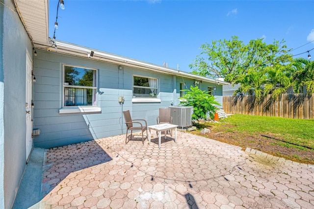 3310 W Swann Ave, Tampa, FL 33609 - view of patio / terrace with central air condition unit and fence