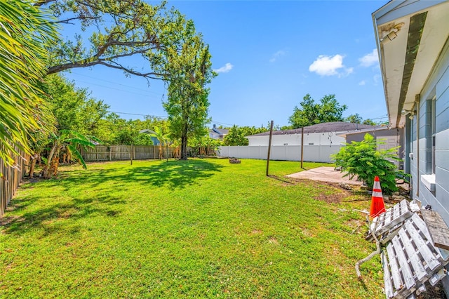 3310 W Swann Ave, Tampa, FL 33609 - view of yard featuring a patio and a fenced backyard