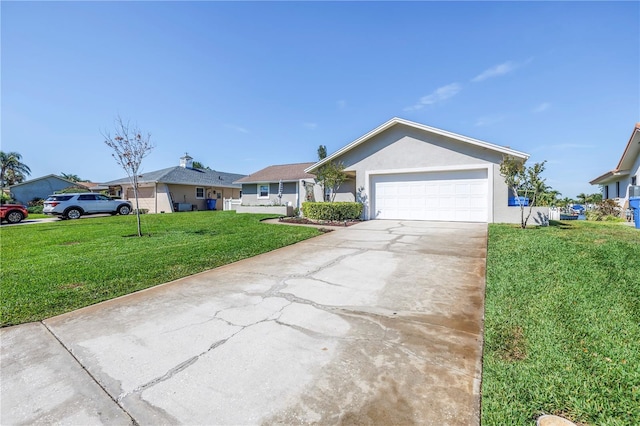ranch-style home with a garage, stucco siding, concrete driveway, and a front yard