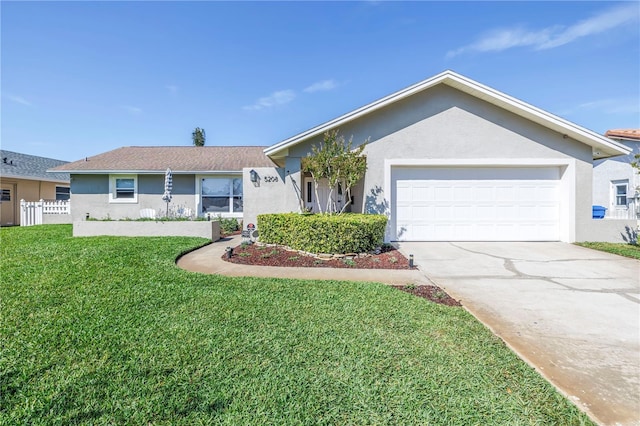 ranch-style house featuring a front lawn, a garage, driveway, and stucco siding