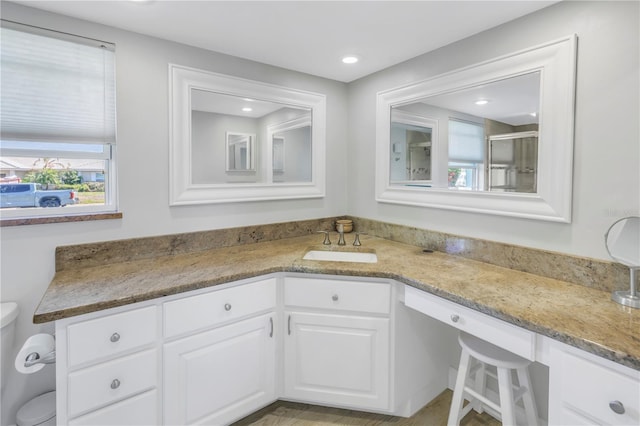 full bathroom with recessed lighting, toilet, and vanity