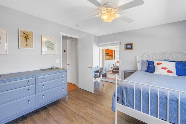 bedroom with light wood finished floors and a ceiling fan