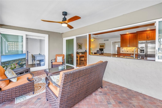 view of patio / terrace featuring a sink, visible vents, and a ceiling fan