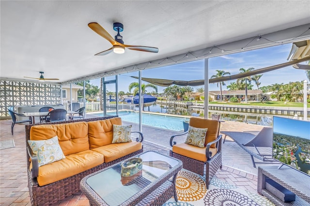 view of patio / terrace featuring an outdoor pool, an outdoor hangout area, outdoor dining space, and a ceiling fan