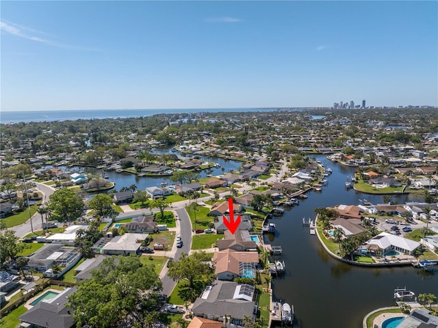 birds eye view of property featuring a residential view and a water view
