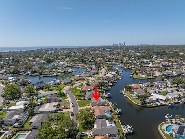 drone / aerial view featuring a residential view and a water view