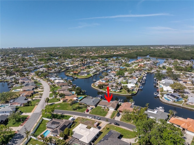 drone / aerial view featuring a residential view and a water view