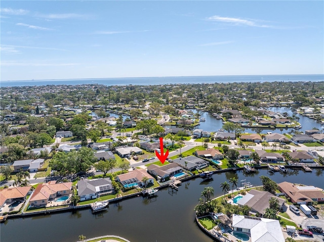 bird's eye view featuring a water view and a residential view