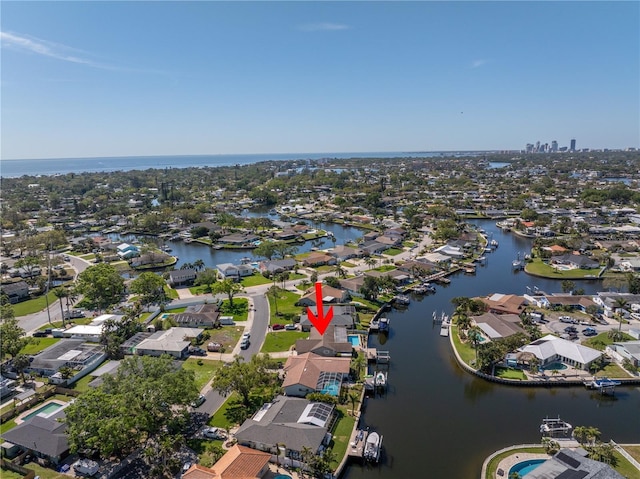 aerial view featuring a residential view and a water view