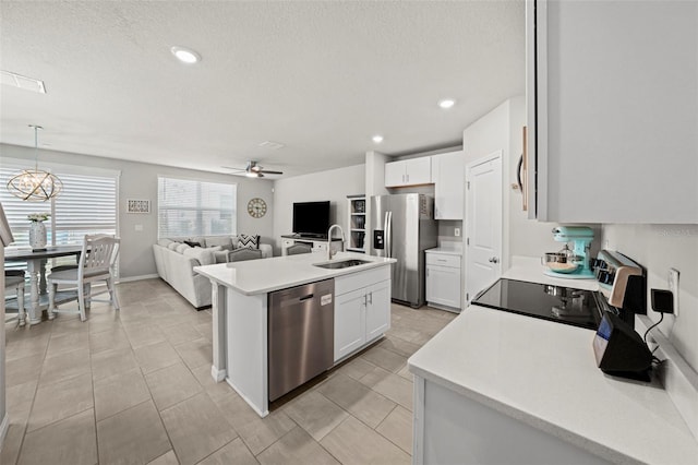 2760 Scarlet Bay Pl, Brandon, FL 33510 - kitchen with open floor plan, appliances with stainless steel finishes, light countertops, and a sink