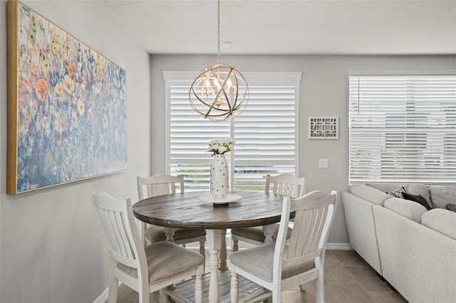 2760 Scarlet Bay Pl, Brandon, FL 33510 - tiled dining space with baseboards and a chandelier