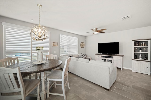 2760 Scarlet Bay Pl, Brandon, FL 33510 - dining space with visible vents, plenty of natural light, ceiling fan with notable chandelier, and baseboards