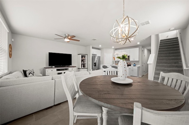 2760 Scarlet Bay Pl, Brandon, FL 33510 - dining area featuring recessed lighting, stairway, ceiling fan with notable chandelier, and visible vents