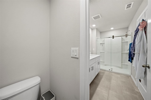 2760 Scarlet Bay Pl, Brandon, FL 33510 - bathroom with visible vents, toilet, a shower stall, and vanity