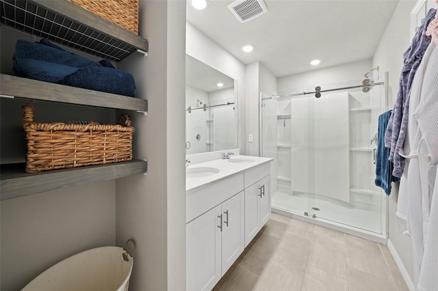 2760 Scarlet Bay Pl, Brandon, FL 33510 - full bathroom with a sink, visible vents, double vanity, and a shower stall