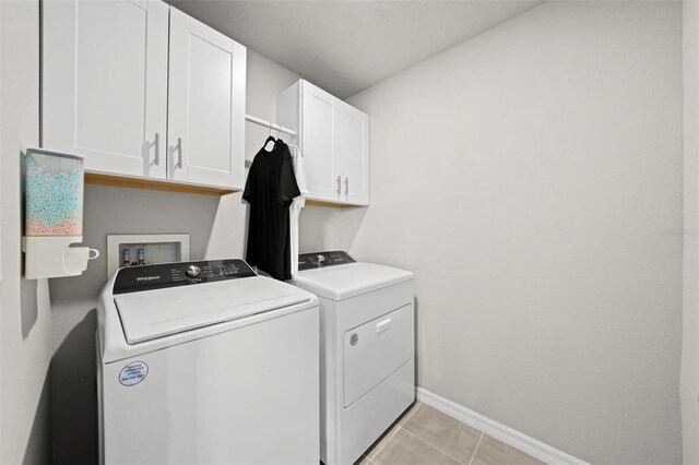 2760 Scarlet Bay Pl, Brandon, FL 33510 - clothes washing area with baseboards, cabinet space, and independent washer and dryer