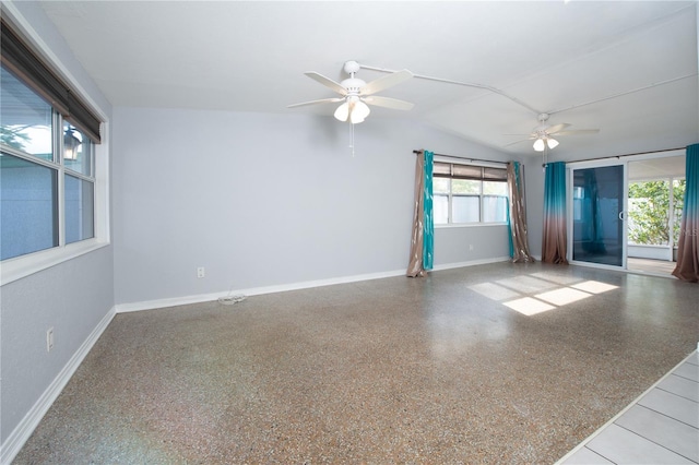 spare room with a ceiling fan, speckled floor, baseboards, and lofted ceiling