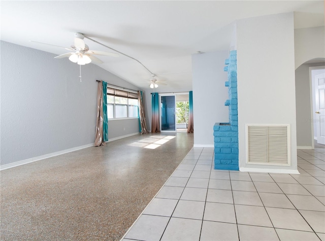 empty room featuring arched walkways, baseboards, ceiling fan, and visible vents