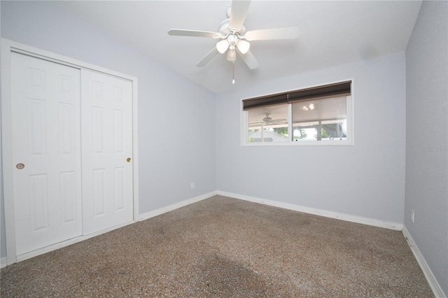 unfurnished bedroom with baseboards, a closet, and a ceiling fan