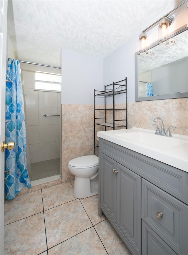 bathroom featuring tile walls, toilet, a tile shower, and tile patterned flooring