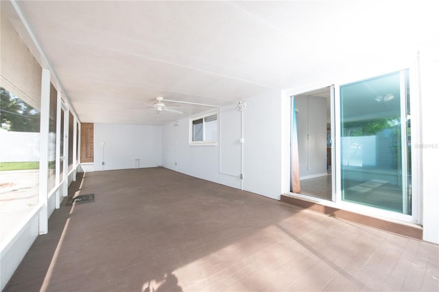 spare room with wood finished floors and a ceiling fan