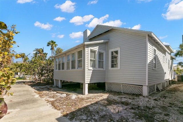 view of side of property with a chimney