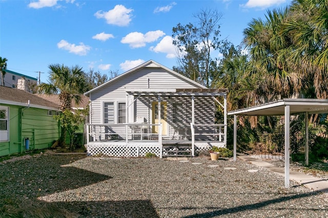 exterior space featuring a pergola and a deck